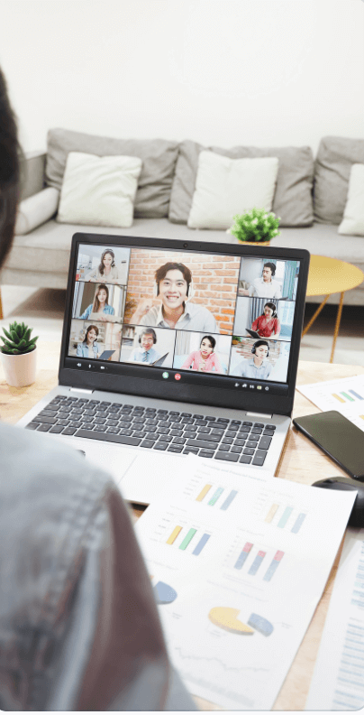 Screen Shot 2024-01-08 at 8.26.59 AM Over-the-shoulder angle of team on virtual meeting